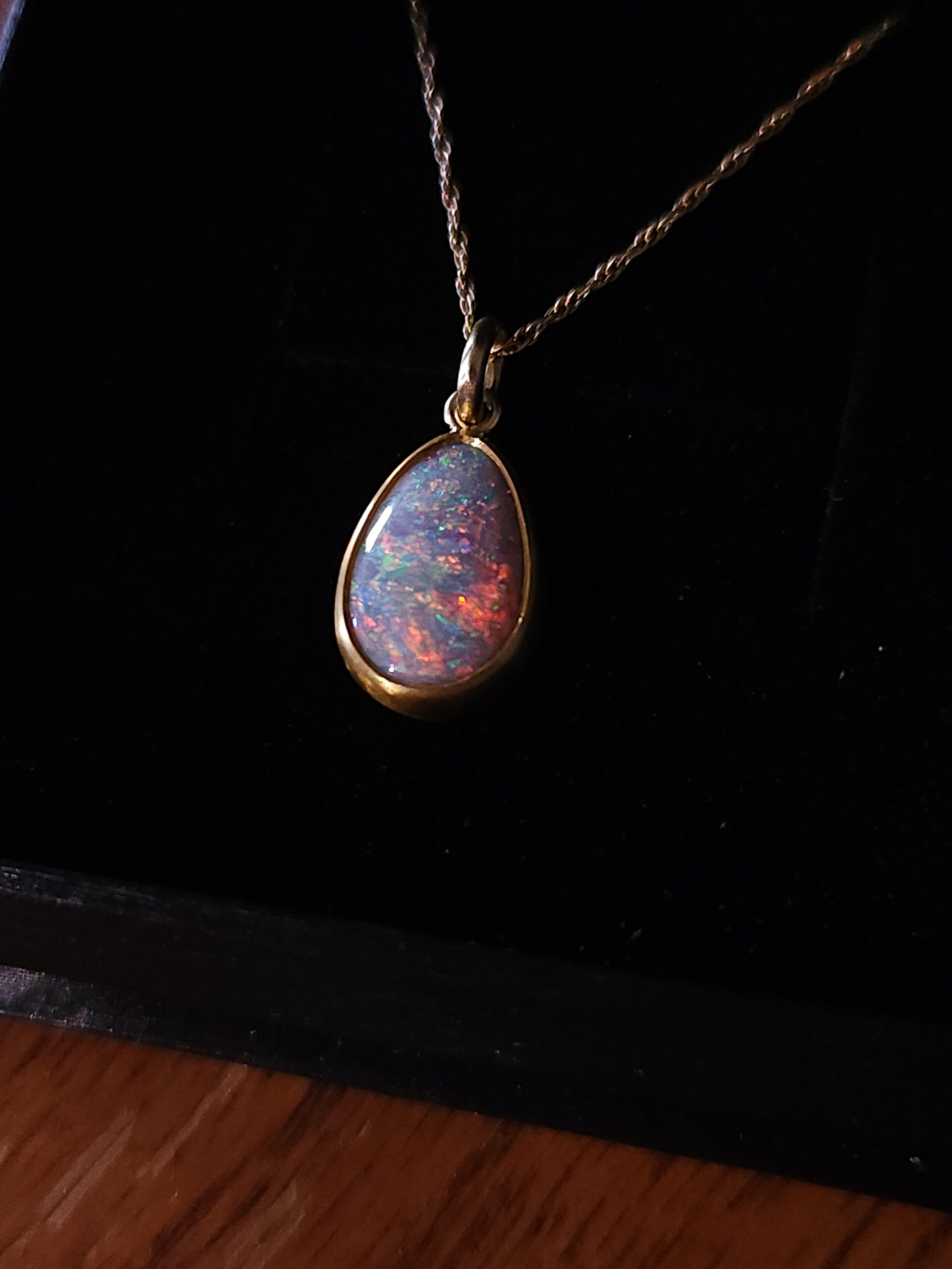 Australian opal pendant with vibrant multicolored flashes, hand-cut by Metrowest Opal. 